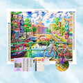 Kit de broderie diamant montrant un canal de ville européenne, des bâtiments colorés et un vélo.