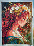 Photographie réelle du kit de broderie diamant 'Chant d'Automne' une fois terminé. On y voit le portrait de la femme rousse avec sa couronne de fleurs, ainsi que la charte de couleurs sur les bords de la toile (60x83cm).