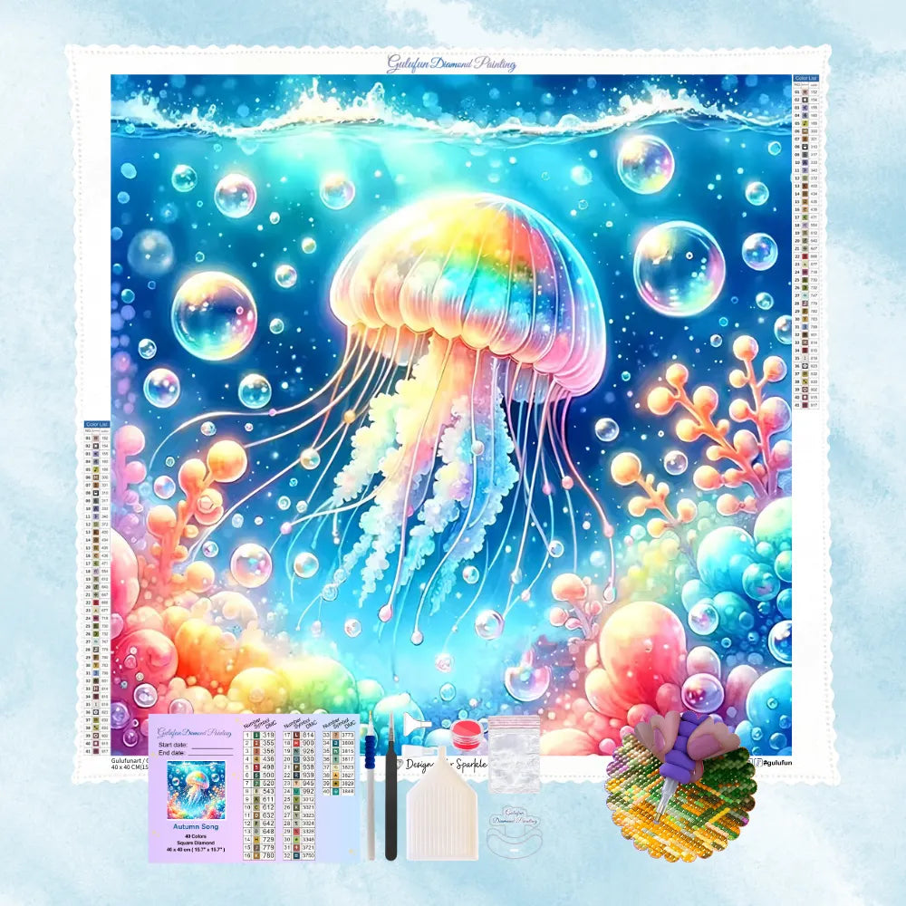 Kit de broderie diamant illustrant une méduse lumineuse et colorée entourée de bulles d'eau et de coraux.
