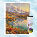 Kit complet de broderie diamant montrant un paysage de montagnes enneigées et un lac paisible aux forêts d'automne