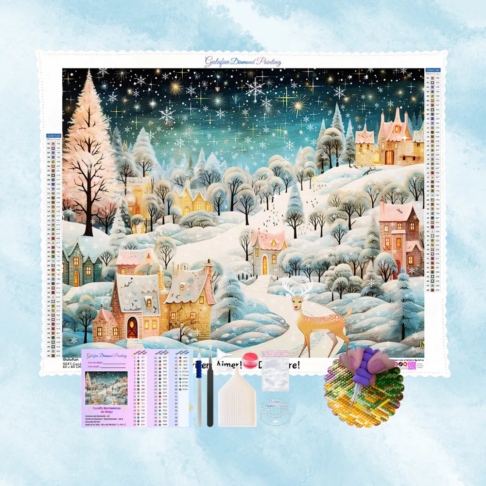 Kit complet de broderie diamant montrant un village féérique sous la neige avec un cerf et un ciel étoilé